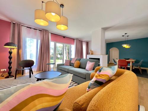 a living room with a couch and a table at Humboldt Garden in La Orotava