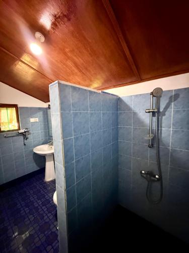 a bathroom with a shower and a sink at Dara Place in Dickwella