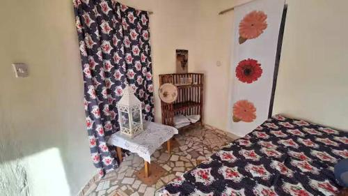 a bedroom with a crib and a crib at Happy Corner Beach Garden in How Ba
