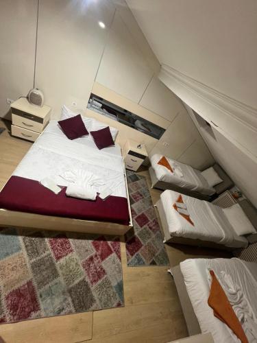 a attic bedroom with a bed with pillows on it at Taksim Pera Premium Gold Hotel in Istanbul