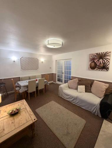 a living room with a couch and a table at Rotherham Meadowhall in Rotherham