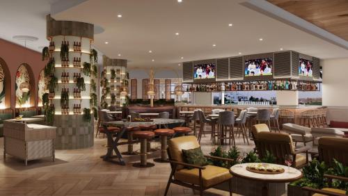 a restaurant with tables and chairs and a bar at The Westin Tampa Bay in Tampa