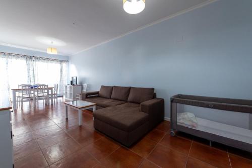 a living room with a couch and a table at Apartamentos Amarelo in Caniçal