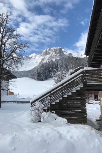 a snow covered staircase with a mountain in the background at Apartment mit Balkon by Interhome in Padola