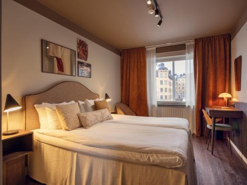 Кровать или кровати в номере Elite Hotel Arcadia