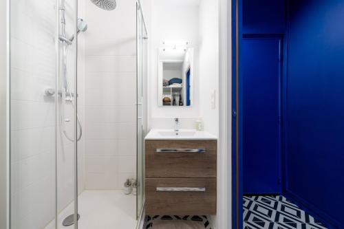 a bathroom with a sink and a shower at Best Place - Studio hyper centre ville d'Arras in Arras