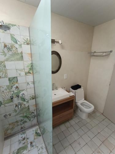 a bathroom with a toilet and a sink at San Lorenzo II in Chacabuco