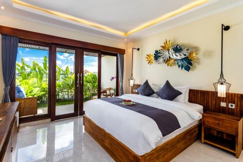 a bedroom with a bed and a large window at Svadarma Bali Villa by Dhananjaya Hospitality in Darmasaba