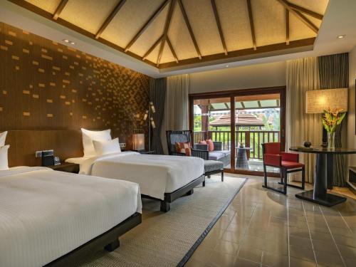 Llit o llits en una habitació de Pullman Luang Prabang
