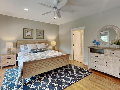 a bedroom with a bed and a ceiling fan at Billfish in Tybee Island