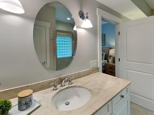 a bathroom with a sink and a mirror at Billfish in Tybee Island