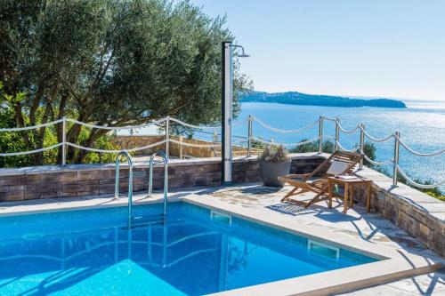 a swimming pool with a view of the water at Apartment LaVilla in Mlini