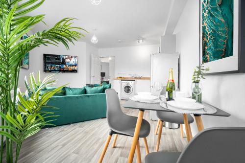a dining room and living room with a table and chairs at Modern 2 Bed Apartment - Parking - Sleeps 3 - Netflix 27AC in Sleightholme