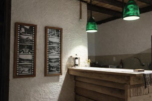 a bathroom with a sink and a mirror at Pousada da Janjana in Nova Iguaçu