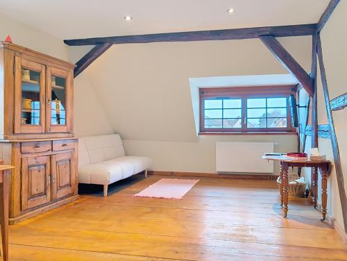 a living room with a couch and a table at Les Perles du Ried - Gîte 9 proche Europa-park in Boofzheim