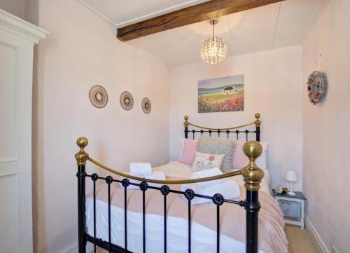 a bedroom with a bed and a chandelier at 2 Bed in Hawes oc-ds042a in Hawes