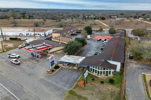 an aerial view of a parking lot at a gas station at Cannon Inn By Capital O Gonzales Tx in Gonzales