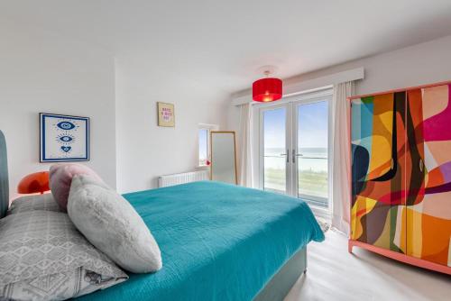 a bedroom with a bed and a large window at 4 Bed in Saltdean oc-a32366 in Saltdean