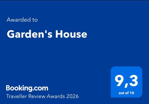 a blue screen with the words gardens house on it at Garden's House in Spata