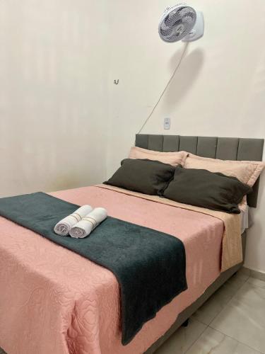a large bed with two towels on top of it at Studio - Serraruna in Araruna