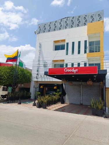 a building with a googleeyes sign on the side of it at Hotel Velero Guajira Real in Fonseca