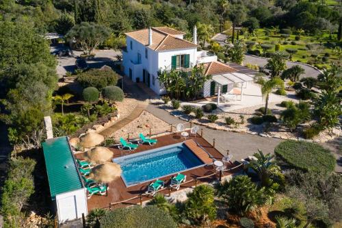 an aerial view of a house with a swimming pool at VILLA CARACOL with Heated Pool & Mini-Golf in Luz de Tavira