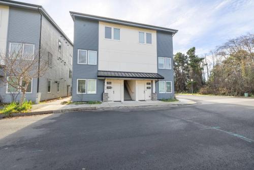 a large house with a garage on a street at Bay View Loft in Lincoln City