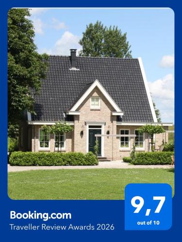 a picture of a house with the textkeeler review awards at Studio Bed and Breakfast Zaans Moment in Assendelft