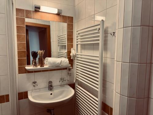 a bathroom with a sink and a mirror at Villa Florl in Schladming