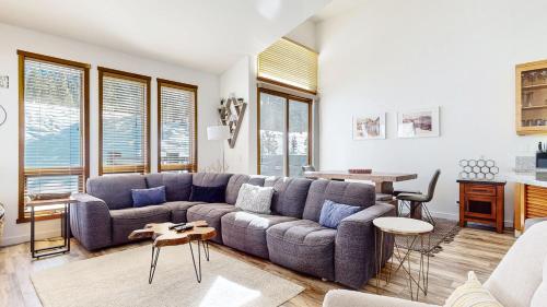 a living room with a couch and a table at Snowcreek V #777 in Mammoth Lakes