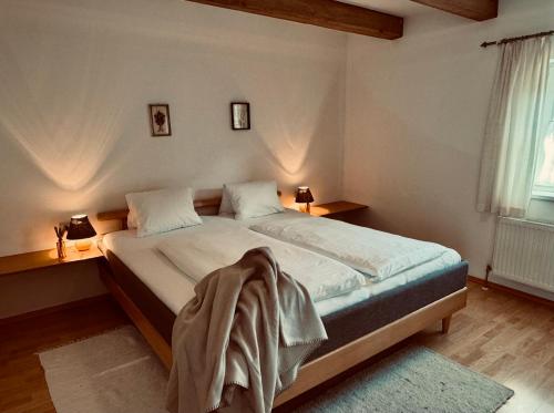 a bedroom with a bed with a blanket on it at Villa Florl in Schladming