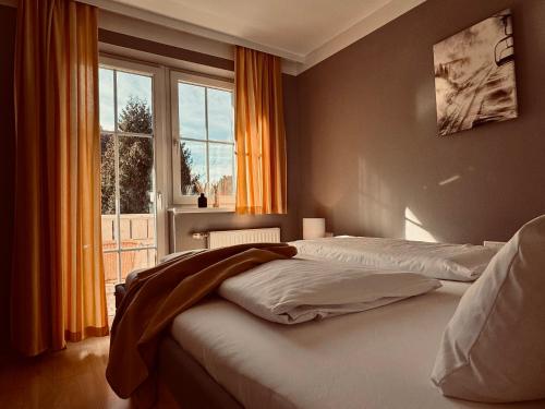 a bedroom with two beds and a window at Dependance I in Schladming