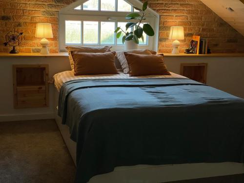 a bedroom with a large bed with a window at Nice getaway, 20 min from Tallinn in Järsi