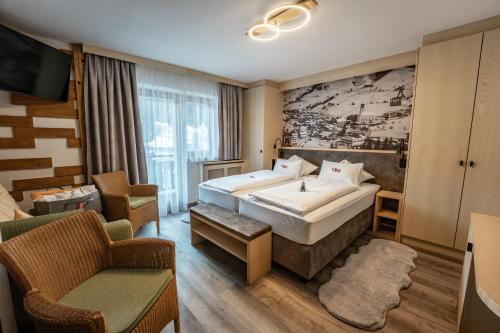 Llit o llits en una habitació de Hotel Eder Michaela