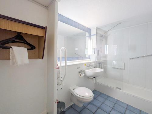 a bathroom with a toilet and a sink and a shower at The Kiln Hotel, Wakefield West Yorkshire, Part of the AG Collection in Wakefield