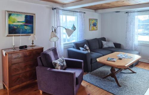 a living room with a couch and a table at Beautiful Home In Tranås With Ethernet Internet in Tranås