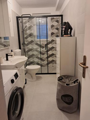 a bathroom with a shower and a toilet and a sink at Holiday Home Manuela in Fažana