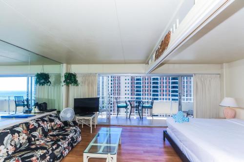 a living room with a couch and a table at Ilikai Tower 1842 in Honolulu