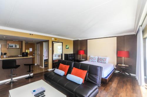 a hotel room with a bed and a couch at Ilikai Tower 420 in Honolulu