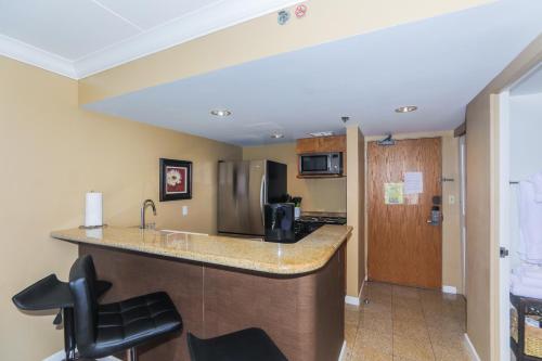 a hotel room with a kitchen with a counter top at Ilikai Tower 420 in Honolulu