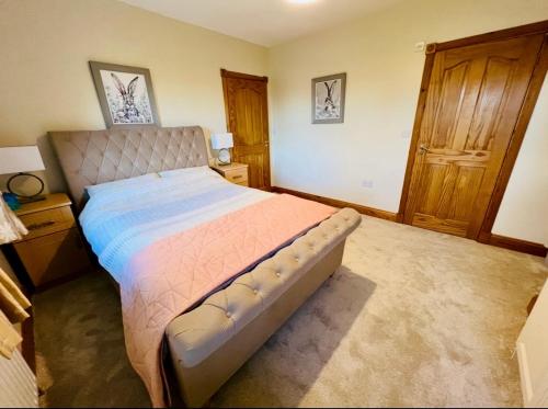 a bedroom with a large bed in a room at Country Hideaway in Limerick