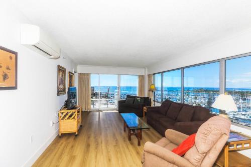 a living room with a couch and a table at Ilikai Tower 943 in Honolulu