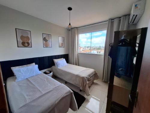a hospital room with two beds and a window at Calma e tranquilidade em Barra Velha in Barra Velha