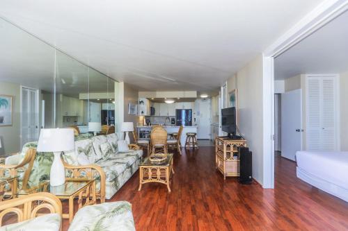 a living room with a couch and a table at Ilikai Marina 682 in Honolulu