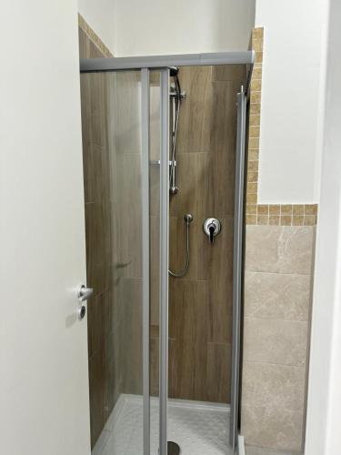 a shower with a glass door in a bathroom at Valdambra B&B in Ambra