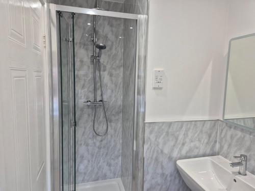 a bathroom with a shower and a sink at Fair View - Off Street Parking and Garden in Shrewsbury