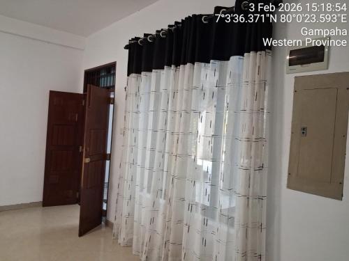 a group of white curtains in a room at Slayan-1 properties in Mudungoda