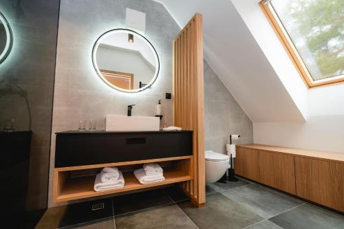 a bathroom with a sink and a mirror at Vineyard Escape Herbersteinova klet in Juršinci