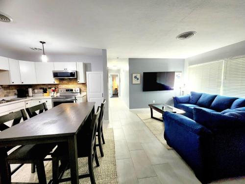 a living room with a blue couch and a table at Blue Door House in Lakeland