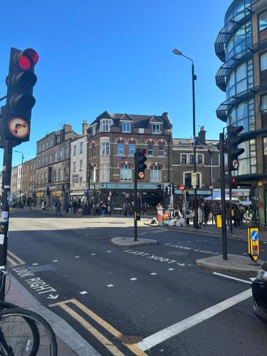an empty city street with a red traffic light at Unique Double Bedroom in London